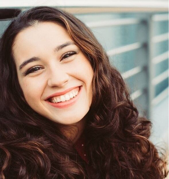 Smiling woman with healthy white teeth representing quality dental care in Edinburg, TX.